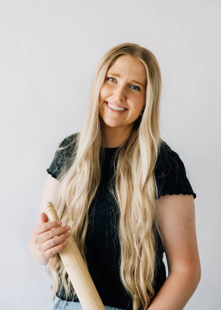 Portrait of Kenna holding a rolling pin