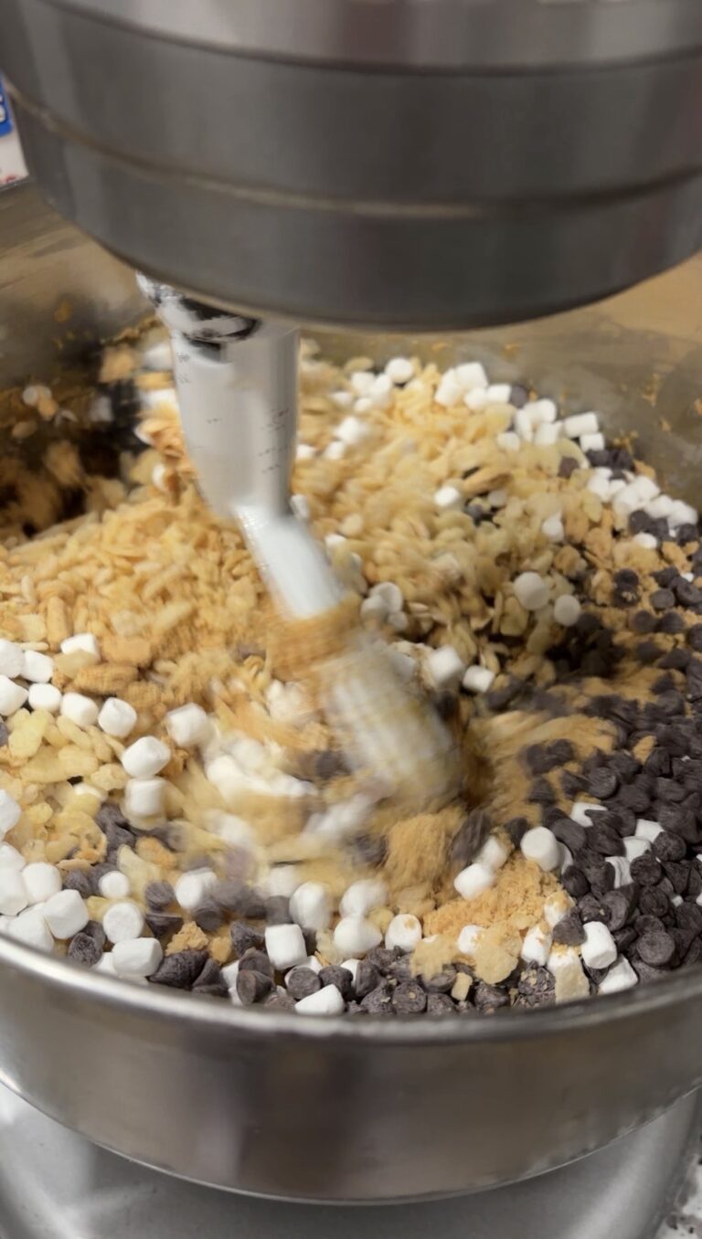 S'mores protein ball mixture with graham crackers, marshmallows and chocolate chips in a stand mixer